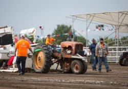 A tractor competing in the antique tractor pull at the MSF arena