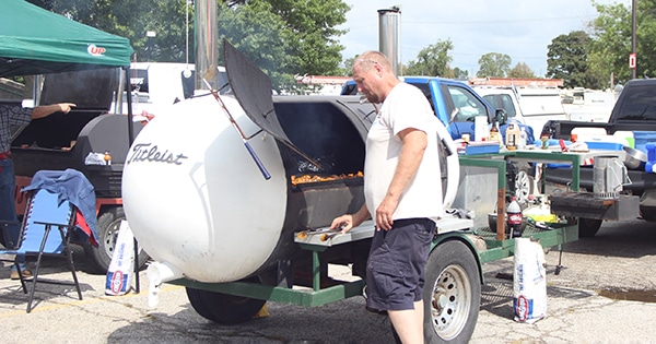 A man barbueing at the Missouri State Fair