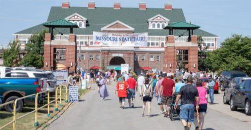 Attendees entering and exiting the fair gates