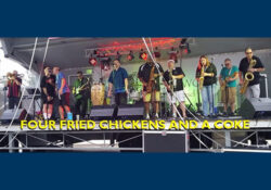 Four Fried Chickens & A Coke playing on a stage outside