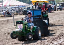 A child competing in the mini pull at the MSF arena