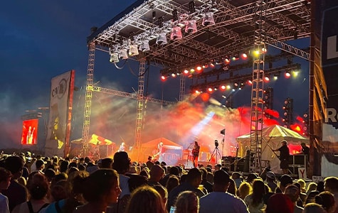 A large crown of people attending a concert at the Grandstand