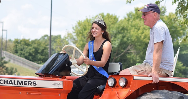 The Missouri State Fair queen driving a tractor