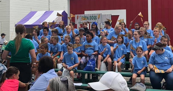 A group of youth attending the fair