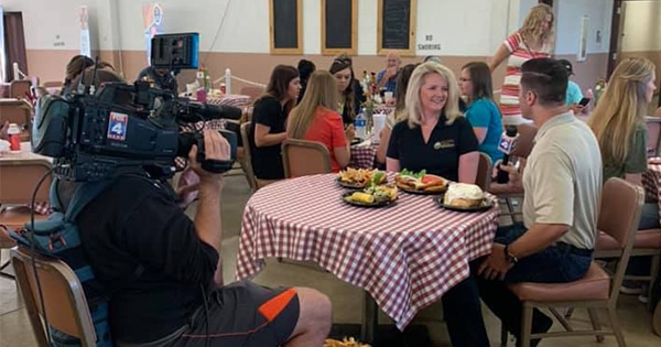 Members of the media conducting an interview at a round table