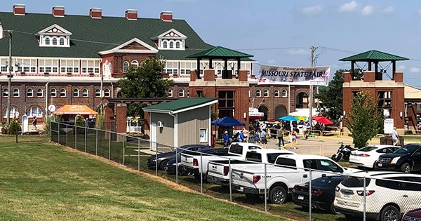 Vehicles parked outside of the fairgrounds