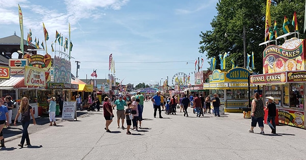 Fair attendees walking down the Midway
