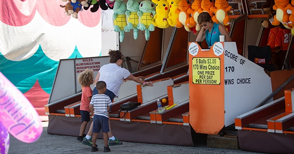 Children playing skiball at the carnival