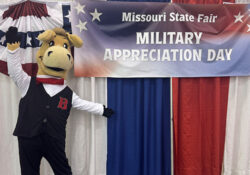 Bart Posing with a Military Appreciation Day sign