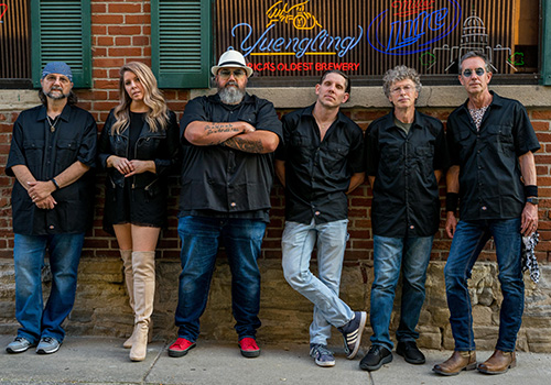 SoulRoot posing as a band outside a bar