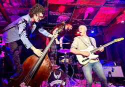 The Vincents playing a show while performing stunts