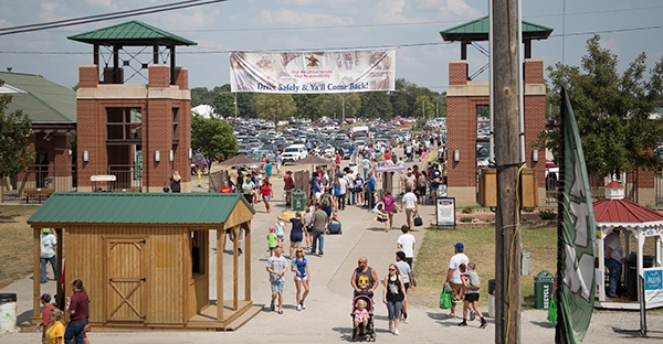 Visitors entering and exiting the gates of the Missouri State Fair